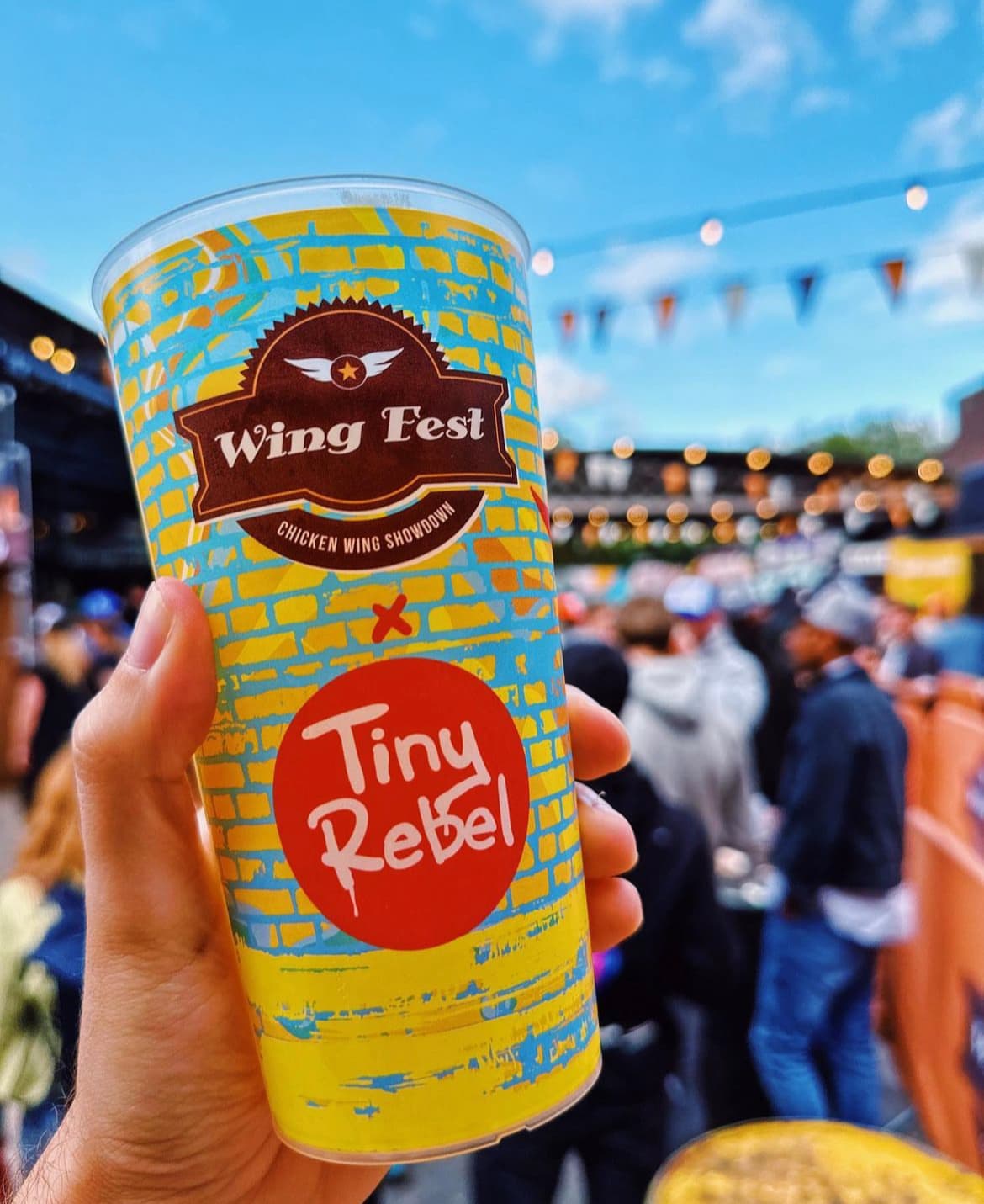 A stack of reusable festival pint glasses in a UK manufacturing setting